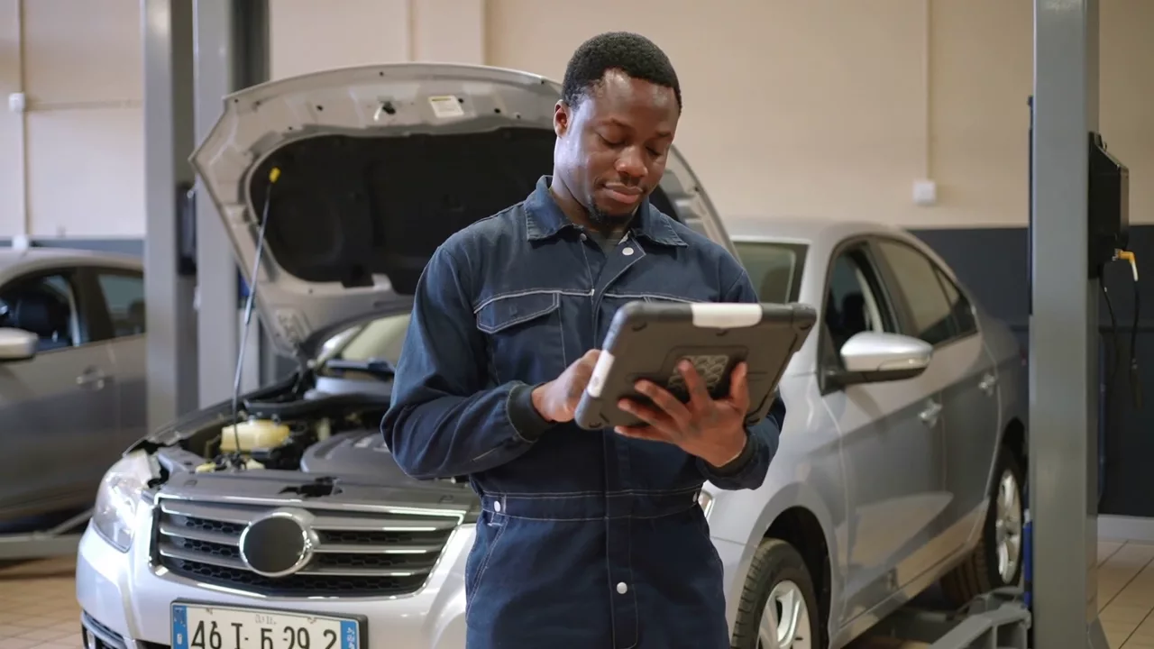 Illustrative automotive service scene with digital tools